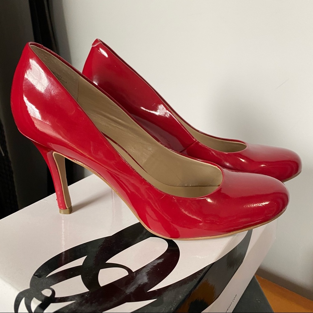 Nine West red patent pumps.